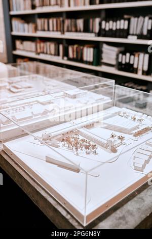 This should give you an idea of what well be doing. Closeup shot of an architectural model in an empty office. Stock Photo