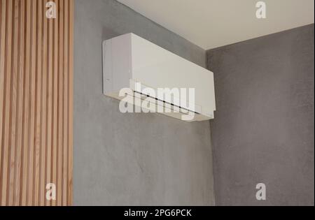 Close up on Ac Unit i modern house interior. Indoor AC unit wall mounted. Stock Photo
