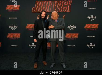 Laurence Fishburne, left, and Keanu Reeves, cast members in John Wick:  Chapter 2, pose together at the premiere of the film at ArcLight Cinemas  on Monday, Jan. 30, 2017, in Los Angeles. (