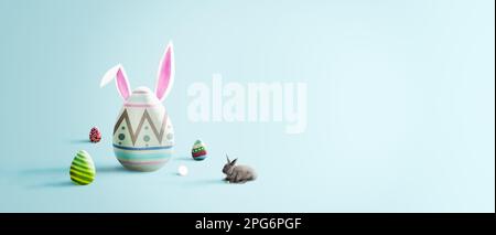 Easter eggs with a bunny ears and rabbit on gentle blue background, happy easter day concept Stock Photo