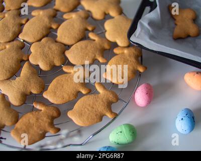 Homemade biscuits on metal grill on white table Stock Photo