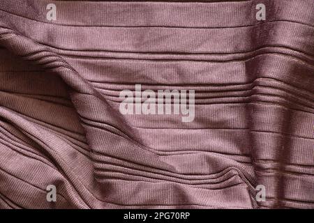 brown silk fabric in pinstripes as background close-up, fashion Stock Photo
