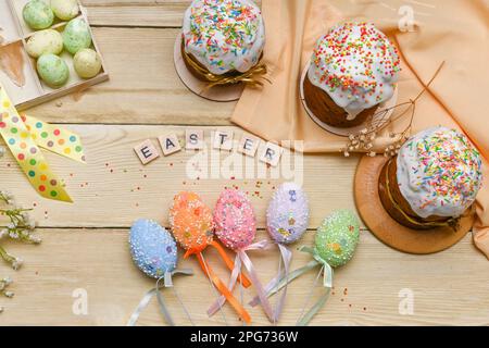 Beautiful Easter concept layout. Easter cakes with eggs. on a wooden table. Stock Photo