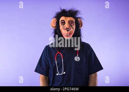 Disguised person in a monkey mask and doctor's outfit, with a phonendoscope, on a purple background. MONKEYPOX, Pandemic, virus, epidemic, Nigeria and Stock Photo