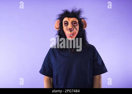 Disguised person with a monkey mask and doctor's outfit, on purple background. MONKEYPOX, Pandemic, virus, epidemic, Nigeria and smallpox concept. Stock Photo