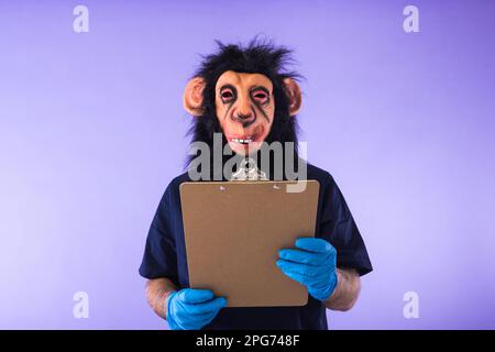 Disguised person in a monkey mask and doctor's outfit, holding a folder, on purple background. MONKEYPOX, Pandemic, virus, epidemic, Nigeria and small Stock Photo