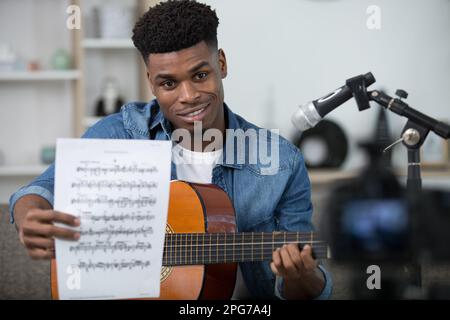 happy man is showing music to the camera Stock Photo