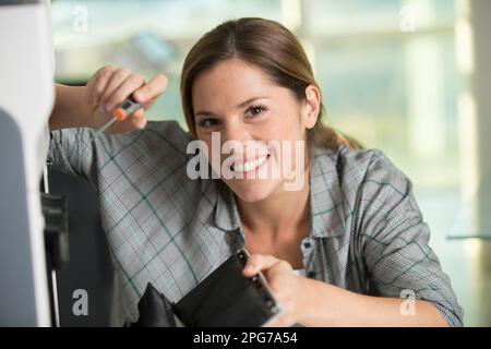happy young woman on printer maintenance Stock Photo