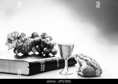 Holy Communion, symbolizing the blood and flesh of Jesus Christ, the Last Supper, bread, wine, grapes, the Bible, Lent, Passion Week, Easter Stock Photo