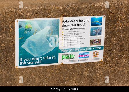 If you don't take it the sea will help get the sea plastic free volunteers help to clean this beach sign at Sidmouth, Devon UK in March Stock Photo