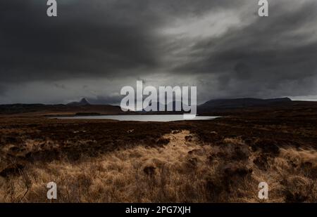 Looking across Loch Osgaig at the mountains of Inverpolly National Nature reserve, Sutherland, Scotland Stock Photo