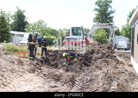 Firefighters must take action if a gas pipe is hit during excavation work at Park de IJsselhoeve in Nieuwerkerk aan den IJssel the Netherlands Stock Photo