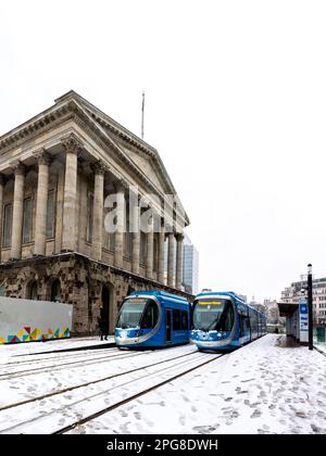 BIRMINGHAM, UK - MARCH 9, 2023.  West Midlands Trams at Birmingham Town Hall building during Winter with heavy snow on the ground disrupting traffic Stock Photo