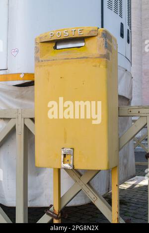 Vatican City, Vatican - December 7, 2022: Yellow Poste Vaticane (Vatican Post) mailbox. Stock Photo