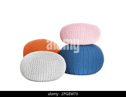 Different stylish poufs on white background. Home design Stock Photo