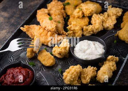 Chicken nuggets, strips and bites Stock Photo