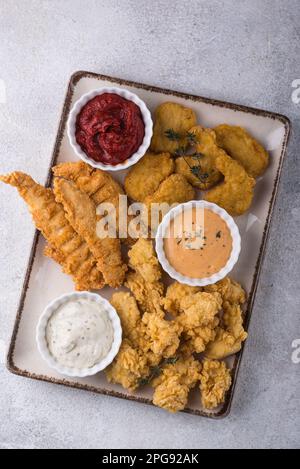 Chicken nuggets, strips and bites Stock Photo