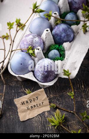 Festive Easter eggs in purple and blue color Stock Photo