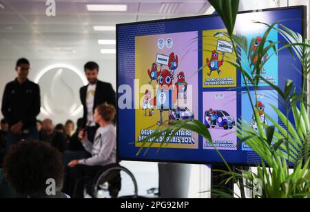 Saint Denis. 21st Mar, 2023. A TV screen shows the information of the volunteers' program of Paris 2024 Olympic and Paralympic Games during a press conference in Saint-Denis, France, March 21, 2023. Credit: Gao Jing/Xinhua/Alamy Live News Stock Photo