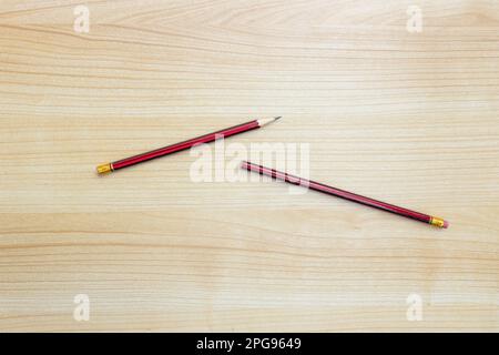 A photo of pencils isolated on wooden background, after some edits. Stock Photo