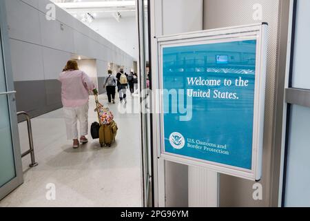 Miami Florida,MIA International Airport,terminal concourse,arriving passengers from Mexico City,welcome sign US Customs and Border Protection,man men Stock Photo