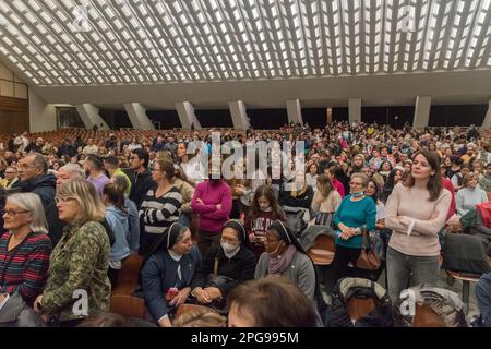 Vatican City, Vatican - December 7, 2022: Pilgrims waiting for public Papal audience inside Paul VI Audience Hall. Stock Photo