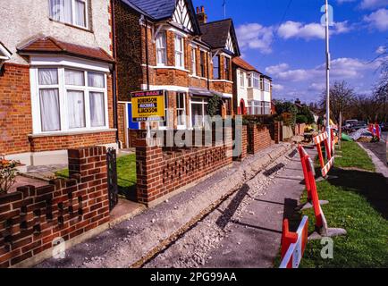 Cable TV and Internet infrastructure being installed in a suburban road in Gravesend Kent in 1990Õs Stock Photo