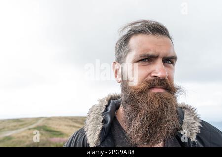 bearded man outdoor, copy space. bearded man has beard. bearded man having moustache. Stock Photo