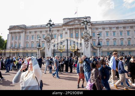 People gather around Buckingham Palace on the first Saturday since the state funeral of the late Queen Elizabeth II. Stock Photo