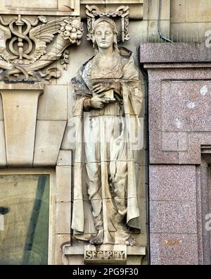 one of four sculptures of allegories the Allegory of security by Phyllis Archibald on an old bank building in st enoch square Glasgow, , UK Stock Photo