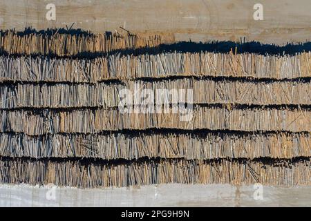 Aerial view over stacked tree trunks / wood piles at paper mill and pulp factory in Värmland, Sweden, Scandinavia Stock Photo