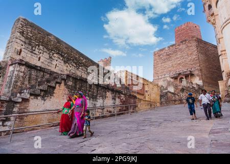 Jodhpur, Rajasthan, India - 19th October 2019 : Indian tourists in modern dresses visiting famous old Mehrangarh fort. UNESCO world heritage site. Stock Photo