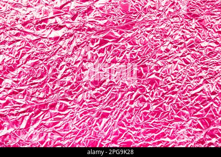 Texture of pink or red foil. crumpled foil Stock Photo