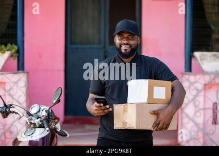 Black African Delivery Courier Man, Postal Shipping and Delivery Concept. Stock Photo