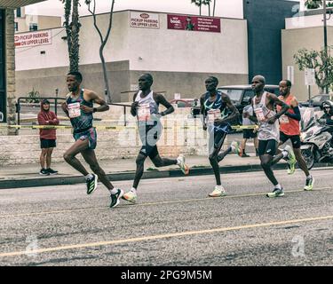 March 19, 2023, Los Angeles, CA, USA: Runners participate in the 38th annual Los Angeles Marathon in Los Angeles, CA. Runners from left to right (Bib Stock Photo