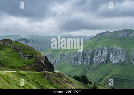 Rough mountain landscape with green and steep limestone slopes in Valles Pasiegos, Cantabria, Spain Stock Photo