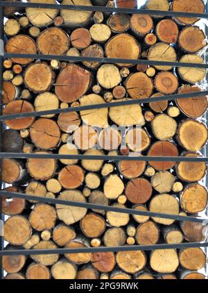 In a pile of pieces of wood cut into firewood for heating Stock Photo