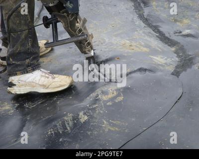 HDPE landfill liner patch installed on a bad weld seam. Stock Photo