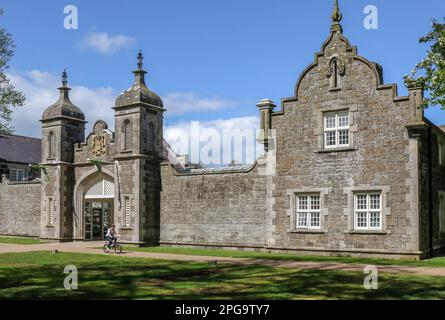 Clotworthy House Jacobean Revival style facade on sunny spring day with blue sky at Antrim Castle Gardens public park and gardens in Northern Ireland Stock Photo