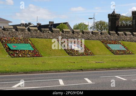 Spring flowerbeds in the town of Antrim celebrating local sporting hero international snooker player Mark Allen who is from the County Antrim town. Stock Photo