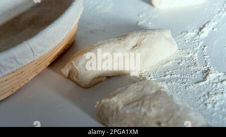 Proofing basket, bannetons bread score on white table, sourdough bread, top side view Stock Photo