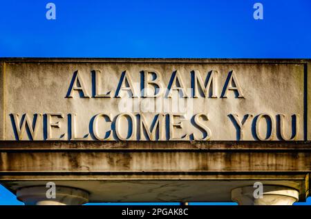 A sign welcomes visitors to the State of Alabama and the Alabama Welcome Center, March 20, 2023, in Grand Bay, Alabama. Stock Photo