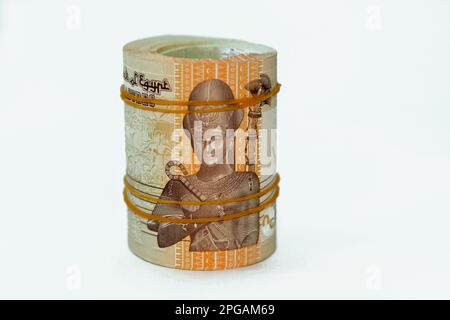 50 Piasters Half EGP LE Egyptian pound cash money bills rolled up with rubber bands with a image of Al Azhar mosque and Ramesses II the second 2nd, Eg Stock Photo