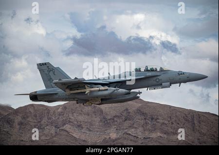 A U.S. Navy EA-18G Growlers assigned to the Electronic Attack Squadron (VAQ) 132, Naval Air Station Whidbey Island, Washington, takes off for a Red Flag-Nellis 23-2 mission at Nellis Air Force Base, Nevada, March 15, 2023. The Growler is a derivative of the F/A-18 Hornet, the US Navy’s maritime strike aircraft. Its mission is mainly electronic attack and suppression of enemy air defenses, particularly at the start and ongoing early stages of hostilities. (U.S. Air Force photo by Senior Airman Zachary Rufus) Stock Photo