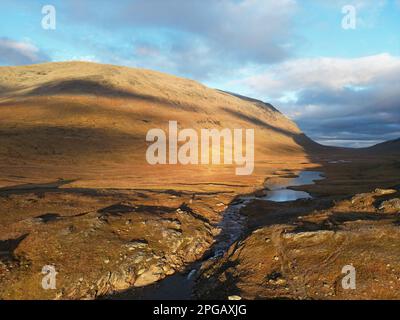An aerial panorama of the hiking trail between Viterskalet and Syter Mountain Huts, October, Swedish Lapland Stock Photo