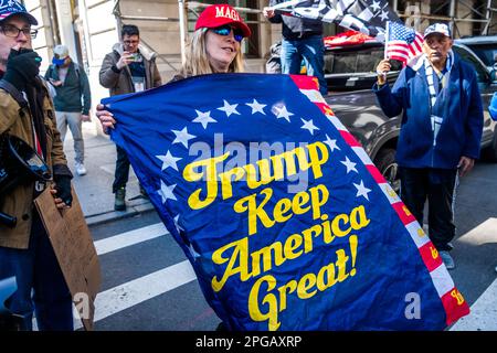 New York, New York, USA. 21st Mar, 2023. A Pro-Trump supporter holds a sign that says 'Trump Keep America Great!' Pro-Trump and Anti-Trump protesters gathered to air their views near the offices of Manhattan DA Bragg in lower Manhattan. Pro-Trump and Anti-Trump protesters gathered to air their views. Lots of signs and shouting waiting for news of an indictment by a grand jury against the former president. (Credit Image: © Milo Hess/ZUMA Press Wire) EDITORIAL USAGE ONLY! Not for Commercial USAGE! Stock Photo