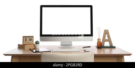 Wooden table with modern computer, decor and stationery on white background Stock Photo