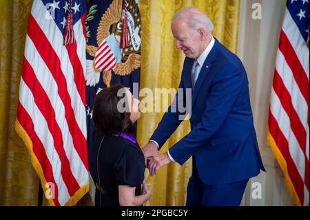 United States President Joe Biden presents the Arts and Humanities Award to actress Julia Louis-Dreyfus, during a ceremony in the East Room of the White House in Washington, DC on Tuesday, March 21, 2023. The National Medal of Arts is the highest award given to artists and arts patrons by the federal government. It is awarded by the president of the United States to individuals or groups who are deserving of special recognition by reason of their outstanding contributions to the excellence, growth, support, and availability of the arts in the United States. Credit: Rod Lamkey / CNP