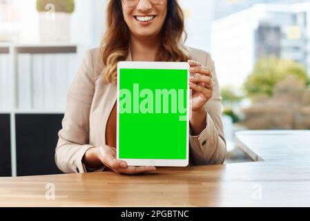 Have a look at this. an unrecognizable businesswoman using a digital tablet in her office. Stock Photo