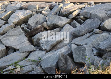 Light gray rock found on side of the beach Stock Photo